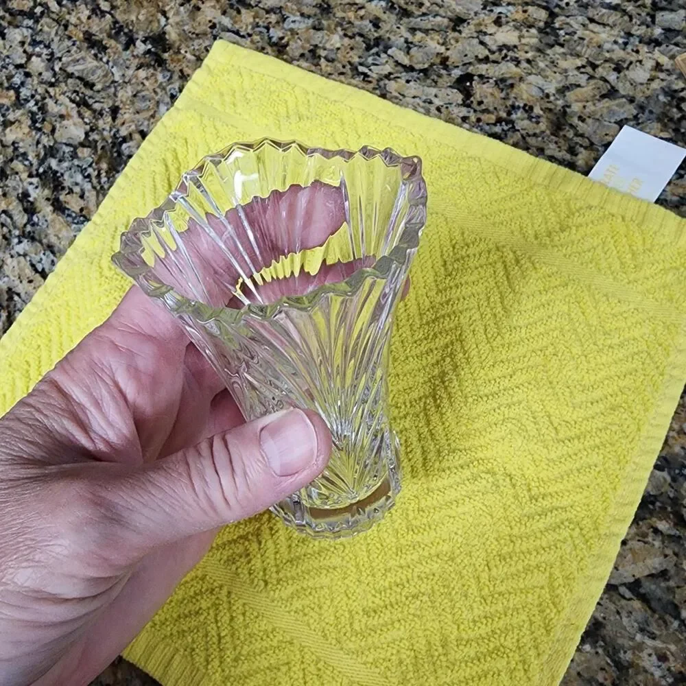 Clear heavy small glass vase approximately 4.75 inches tall